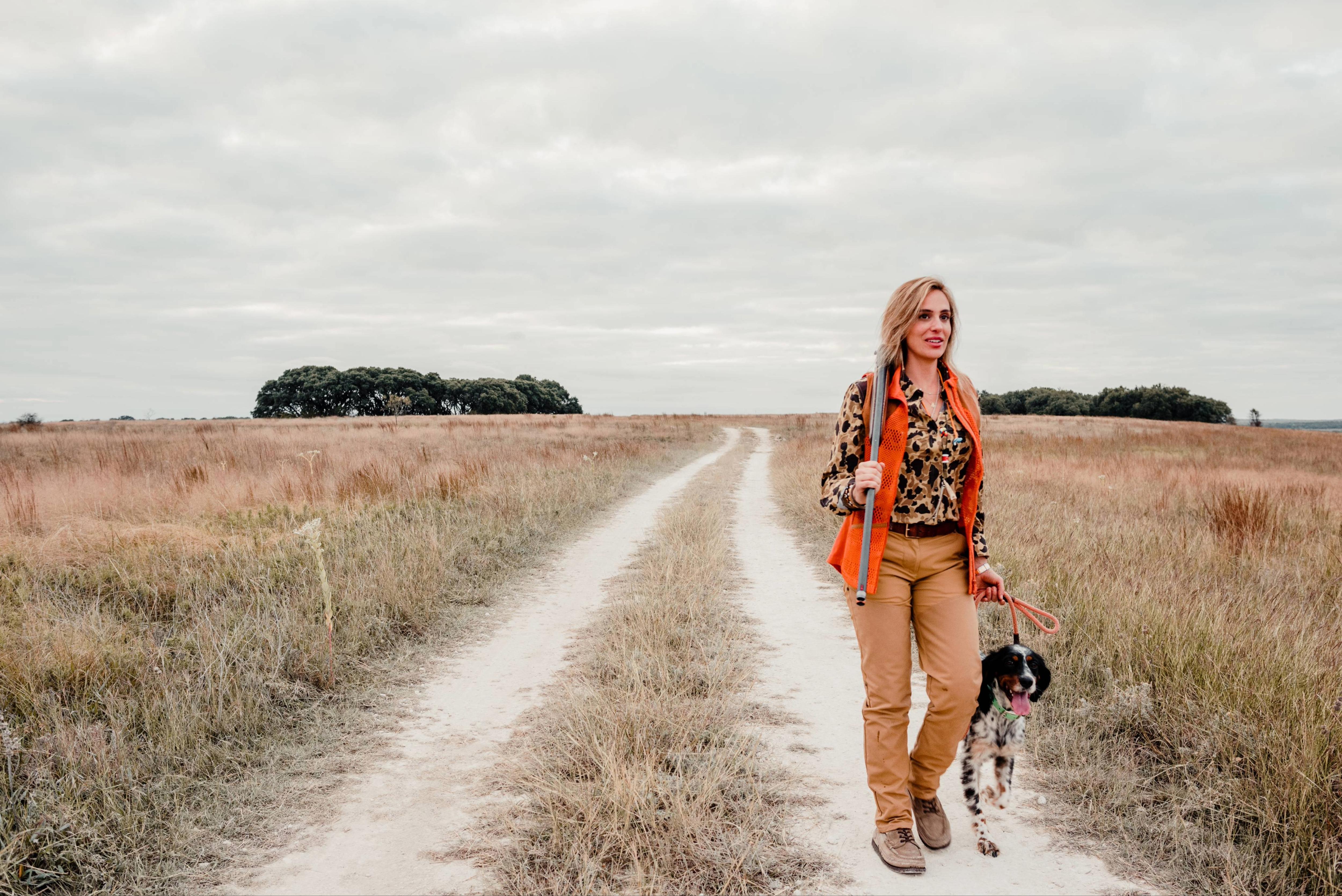 A woman in hunting gear