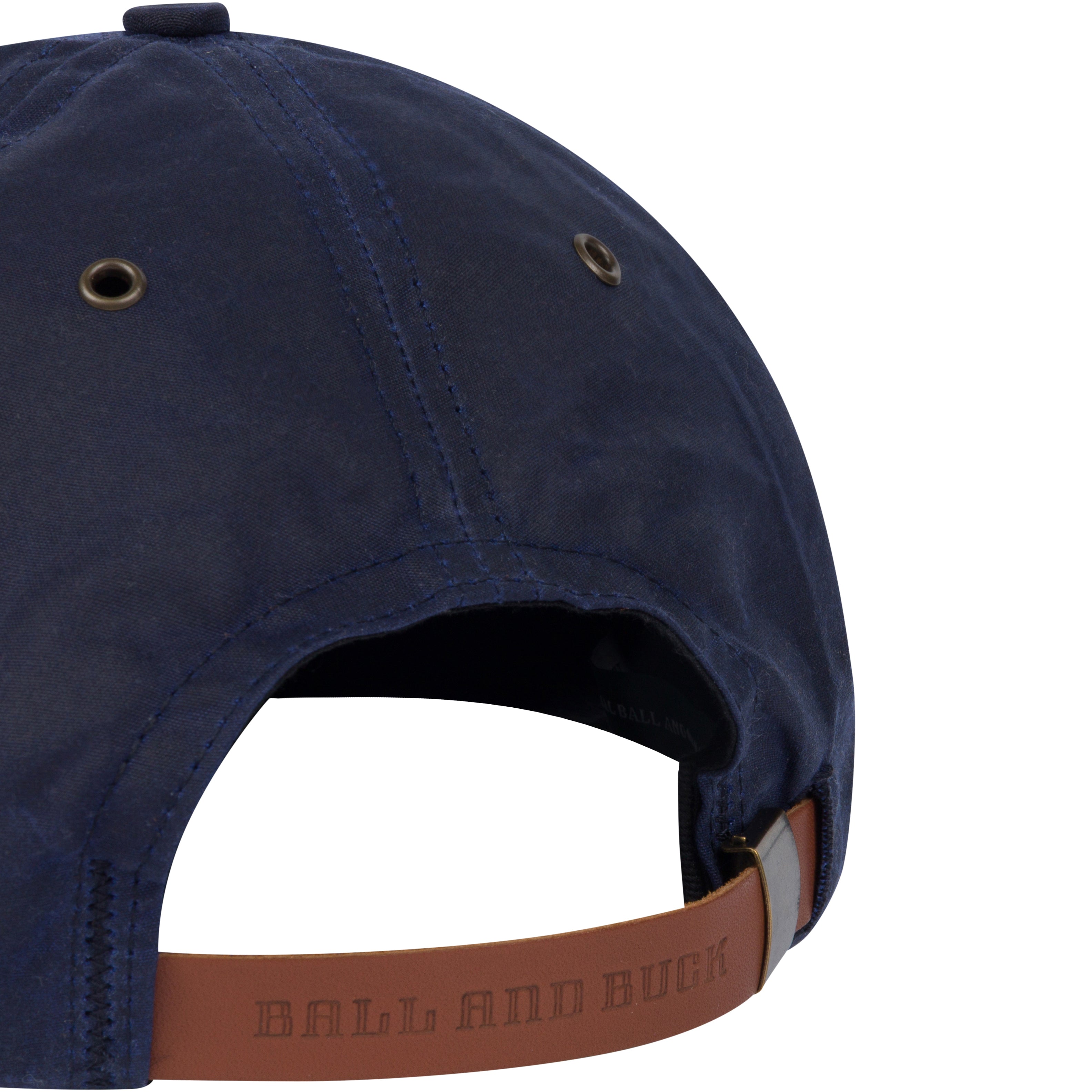 Navy blue cap with brown leather strap and 'Ball and Buck' branding on a white background