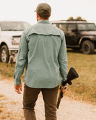 Man in cap, active shirt, and pants