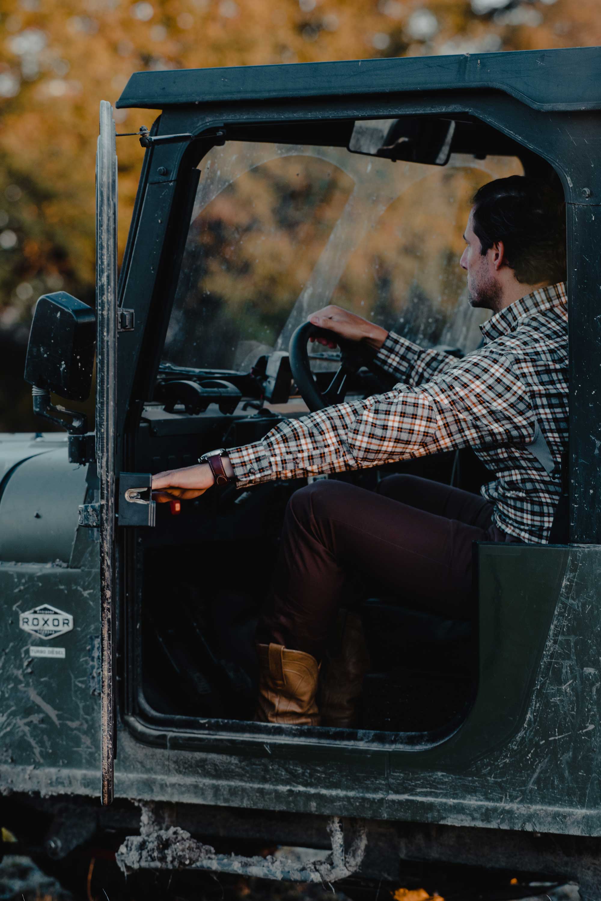 Man in Jeep with Ball and Buck gear